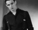 A curated rack of vintage clothing pieces from the 1990s and early 2000s